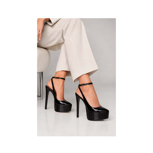 Elle Platform Slingback Pump Black Patent Leather worn by a model