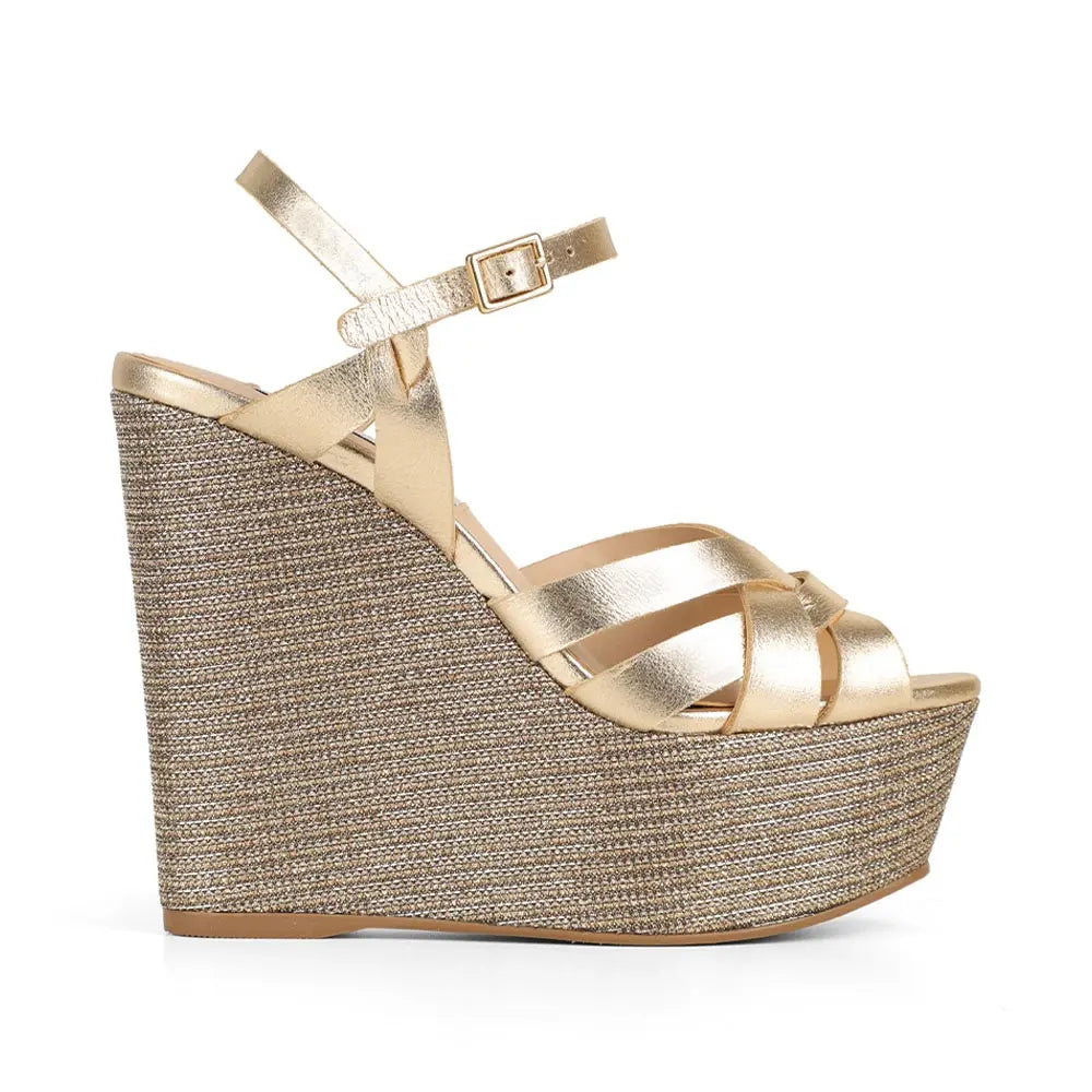 Tainara wedge sandal in gold leather with raffia wedge, side view