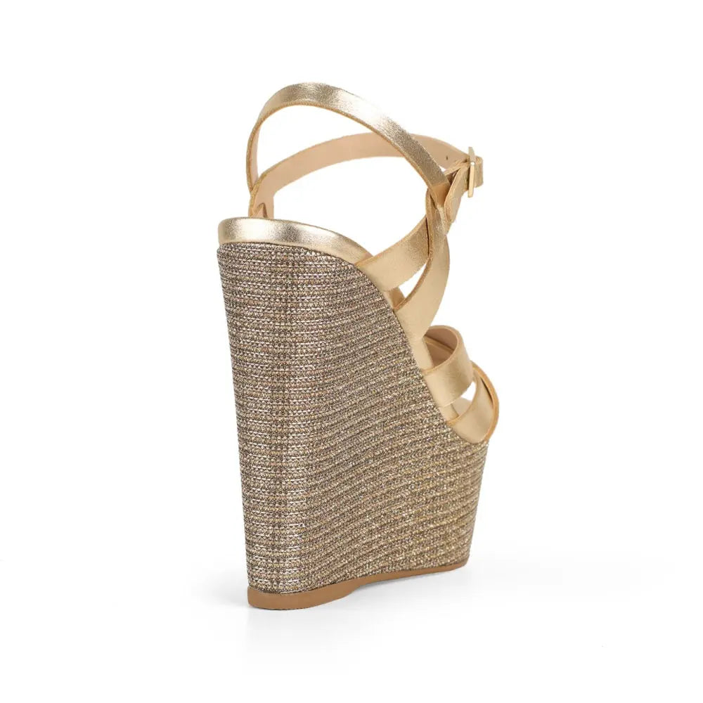 Tainara wedge sandal in gold leather with raffia wedge, back view
