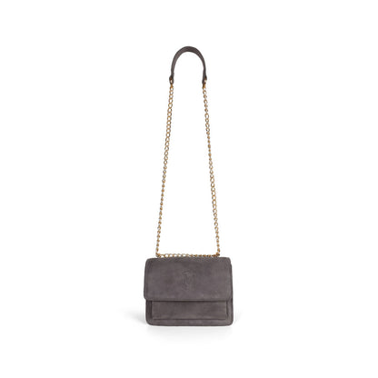 Blair gray suede bag hanging from its gold-tone chain strap