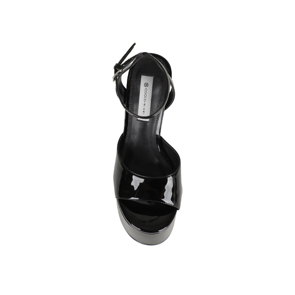 Venus platform sandal in black patent leather, top view of the footbed